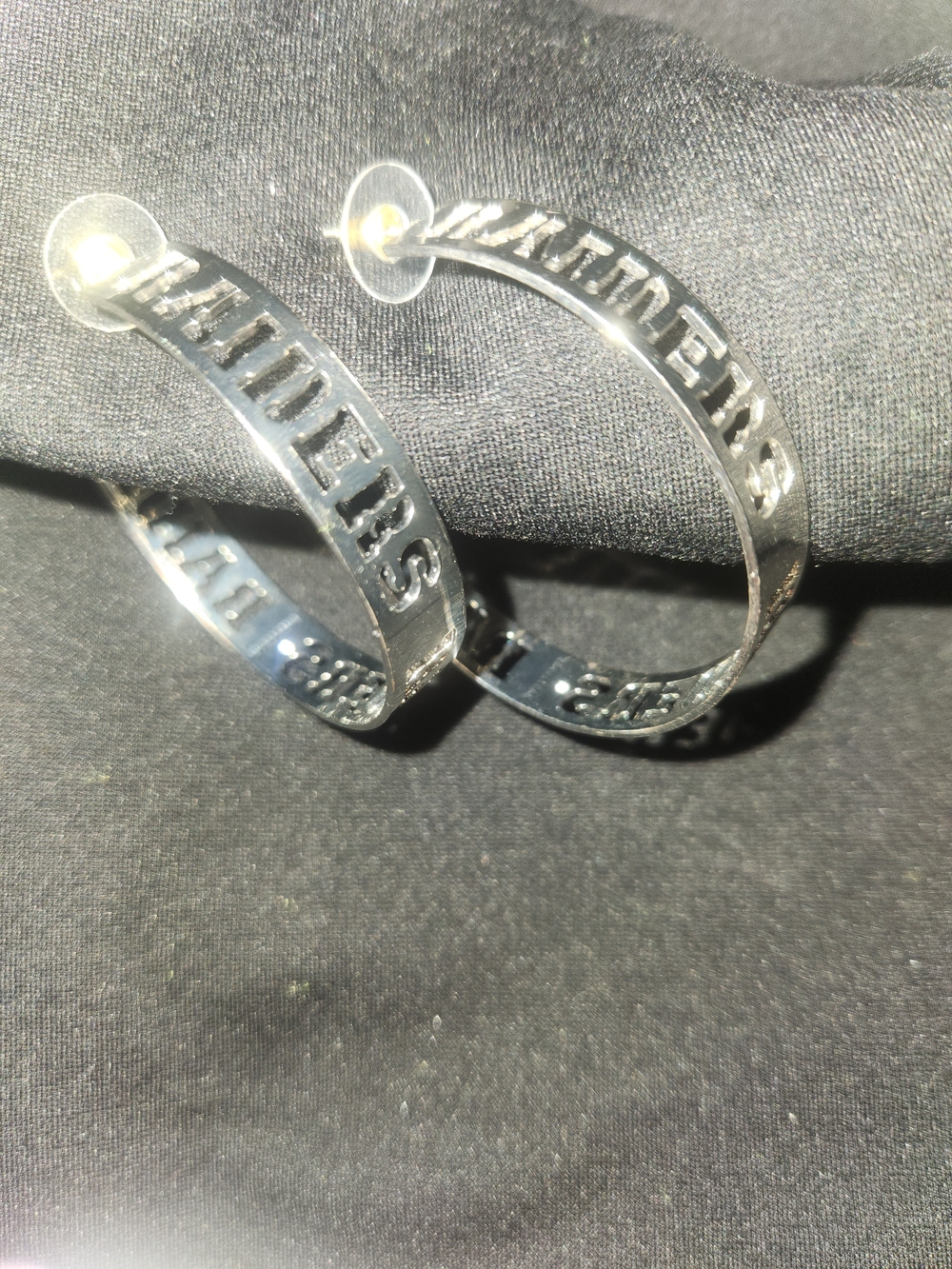 Raiders Silver-Tone Hoop Earrings with Cutout Lettering
